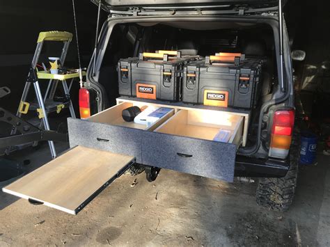 I measured all my pots, pans, equipment and landed a design that created bench seating which converts to a day bed and <strong>drawer</strong>. . Overland drawer system diy